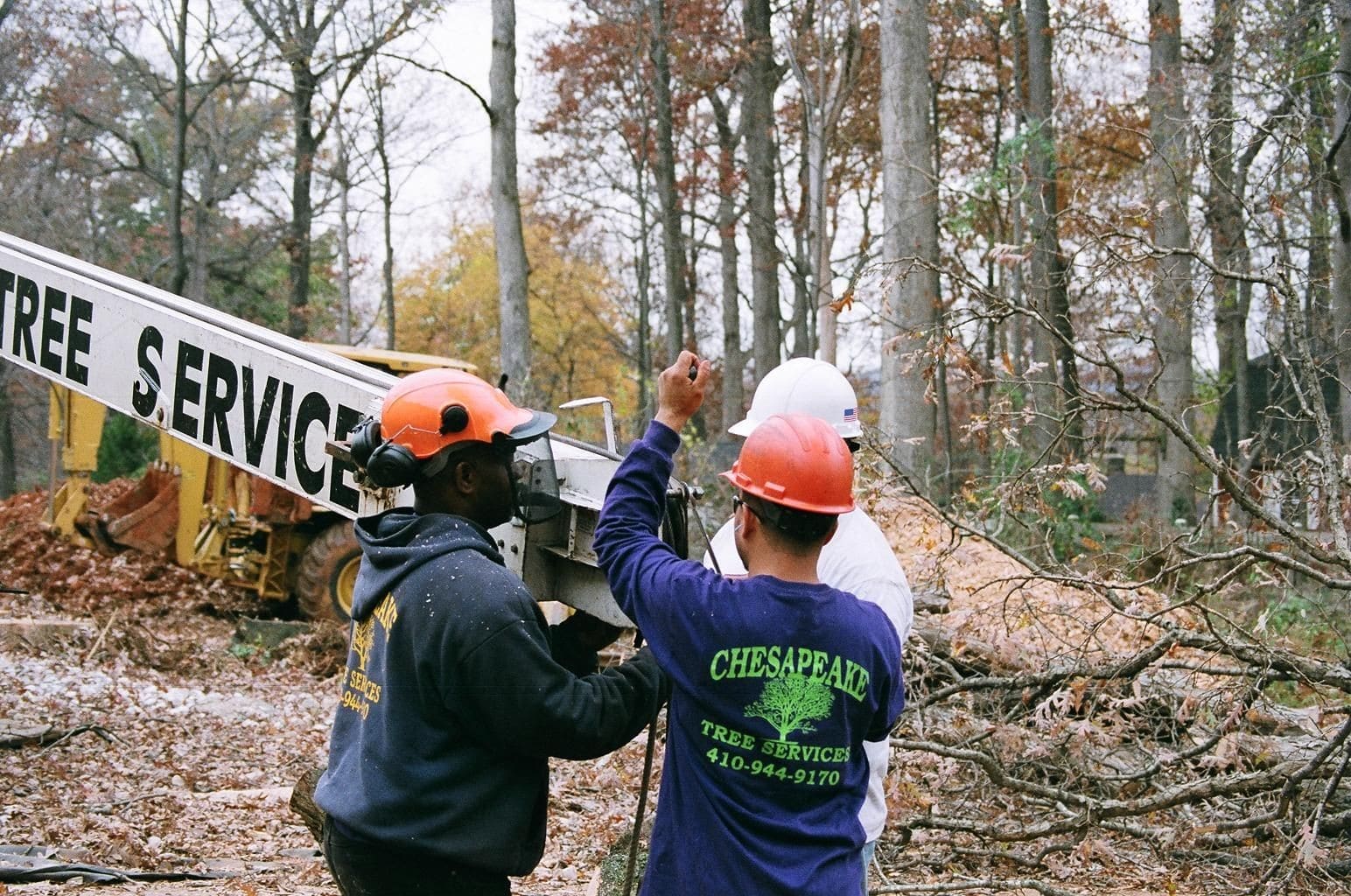 Three Men Working On The Machine